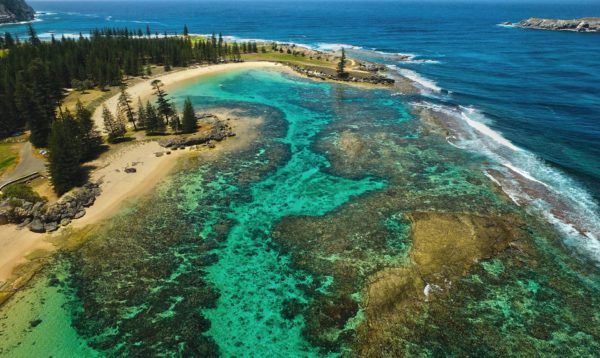 Aerial view of Norfolk Island’s inshore reefs at Slaughter Bay and Emily Bay. .